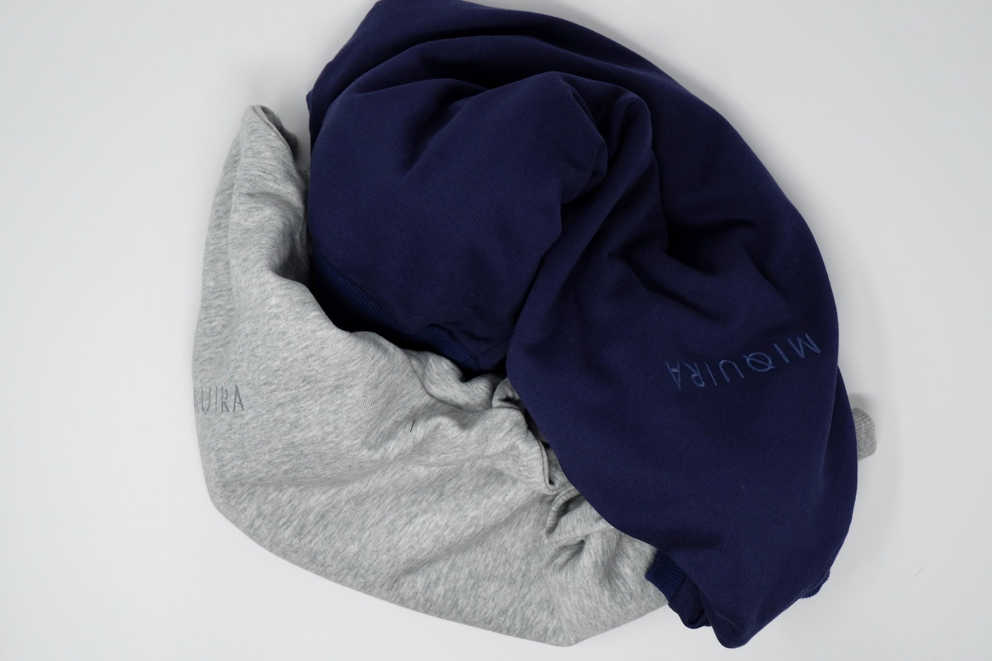Grey and Navy blue variation of a sweatsuit top 